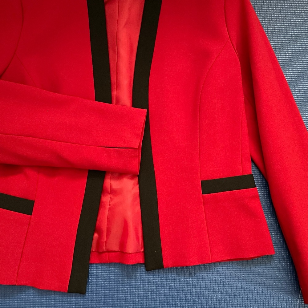 Red suit jacket with black trim